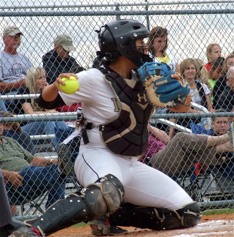 Image: Alyssa Richards(9) keeps a Lady Pirate runner stranded on the third base island but Crawford manages the game 1 win, 3-2.