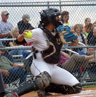 Image: Alyssa Richards(9) keeps a Lady Pirate runner stranded on the third base island but Crawford manages the game 1 win, 3-2.