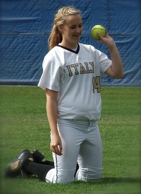 Image: Kelsey Nelson(14) works a softball skills drill before the regional game 1 against Crawford.