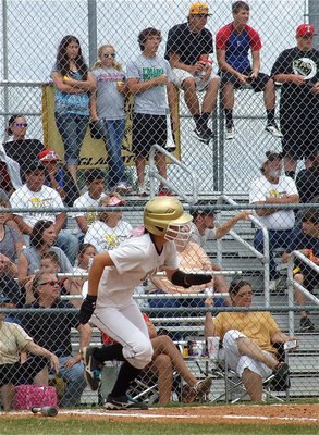 Image: Bailey Eubank(11) hits on base for the Lady Gladiators.