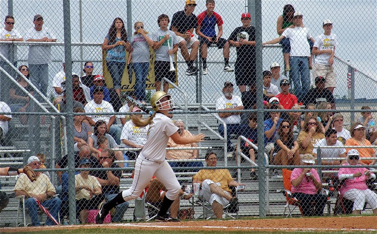 Image: Madison Washington(2) sends a fly ball into right field.