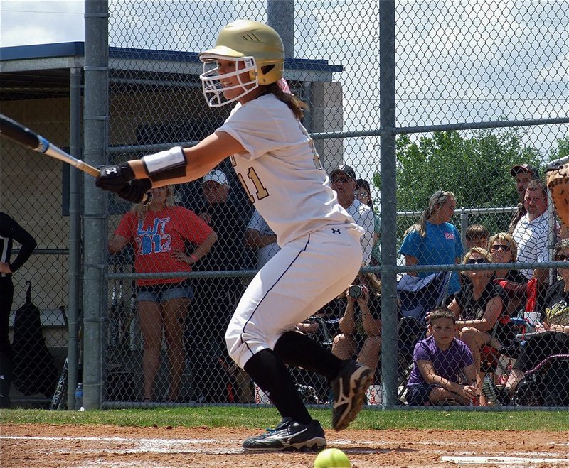 Image: Bailey Eubank(11) slaps down a bunt toward third base.