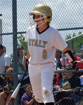 Image: Freshman Lady Gladiator, Tara Wallis(8), steps into the batters’ box.
