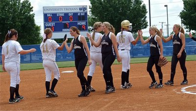 Image: Italy shows class after the game and congratulates Crawford on their 9-3 victory.