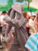 Image: The elephant comes marching through the crowd.