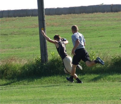 Image: Chase Hamilton brings in a long pass from Marvin Cox to setup Italy’s overtime period touchdown.