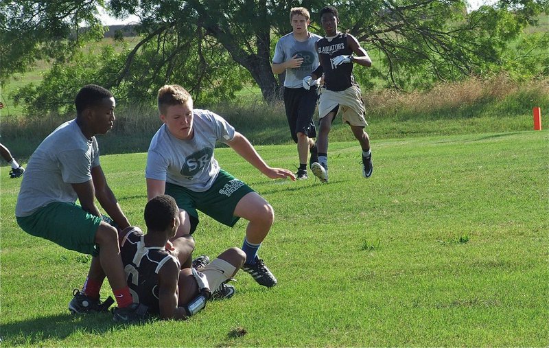 Image: Trevon Robertson gets low to make the catch.