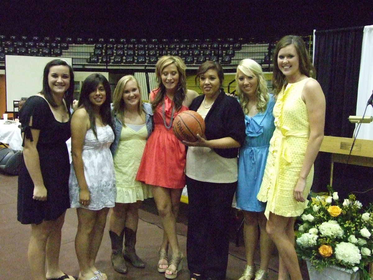 Image: The seniors awarded Coach Richards a team ball.