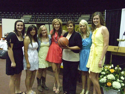 Image: The seniors awarded Coach Richards a team ball.