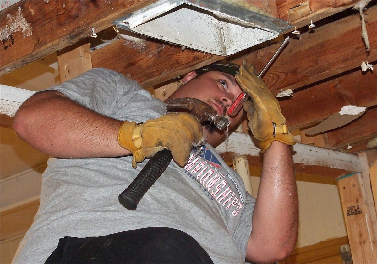 Image: Newly hired coach, Brandon Duncan, helps clear the way for the new look Gladiators. 