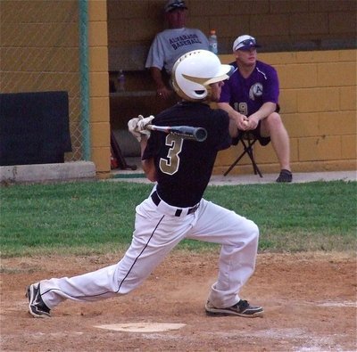 Image: Caden Jacinto(3) gets the bat all the way around for a hit.