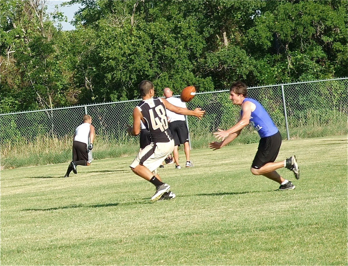 Image: Amazingly, Reid Jacinto(48) reaches back to make this catch against Wortham.