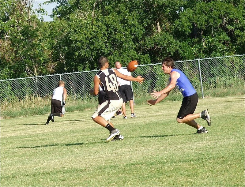 Image: Amazingly, Reid Jacinto(48) reaches back to make this catch against Wortham.