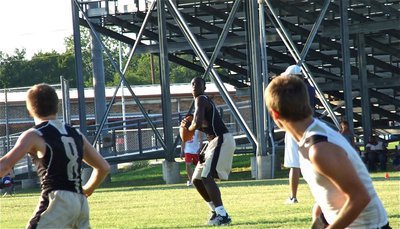 Image: Marvin Cox(3) looks off his outlet receiver, John Escamilla(8), and goes for it all launching a pass into the end zone…