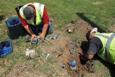 Image: Welcome to the digital age: RG3 Utility foreman, Charlie Bateman, and fellow crewman, Alfredo Bolado, Jr., install a Smart Meter. Replacing all the old drive-by meters within the City of Italy will take about 15 days according to Bateman.