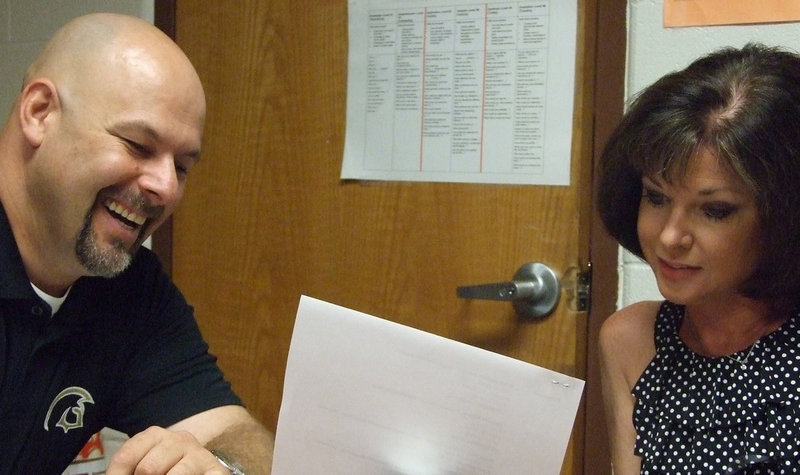 Image: IHS Principal, Lee Joffre, and Andi Windham prepare for the first day of school.