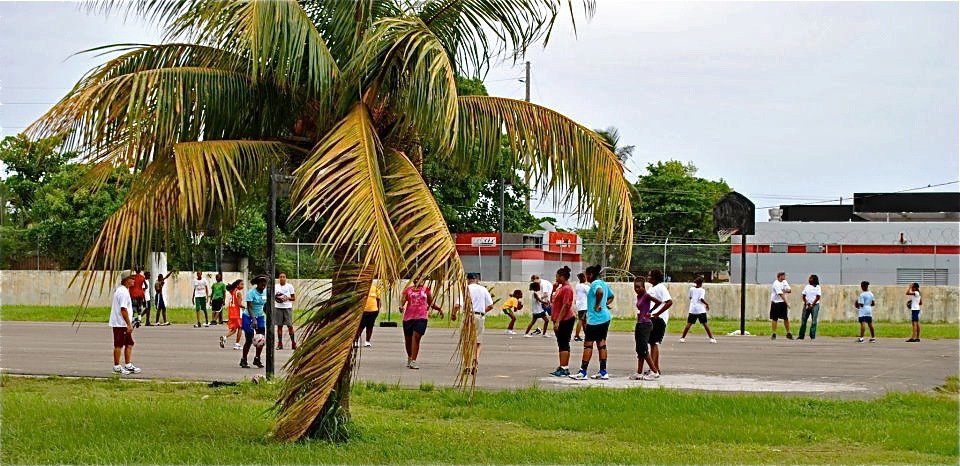 Image: The campers enjoy some time to practice on the outside courts.