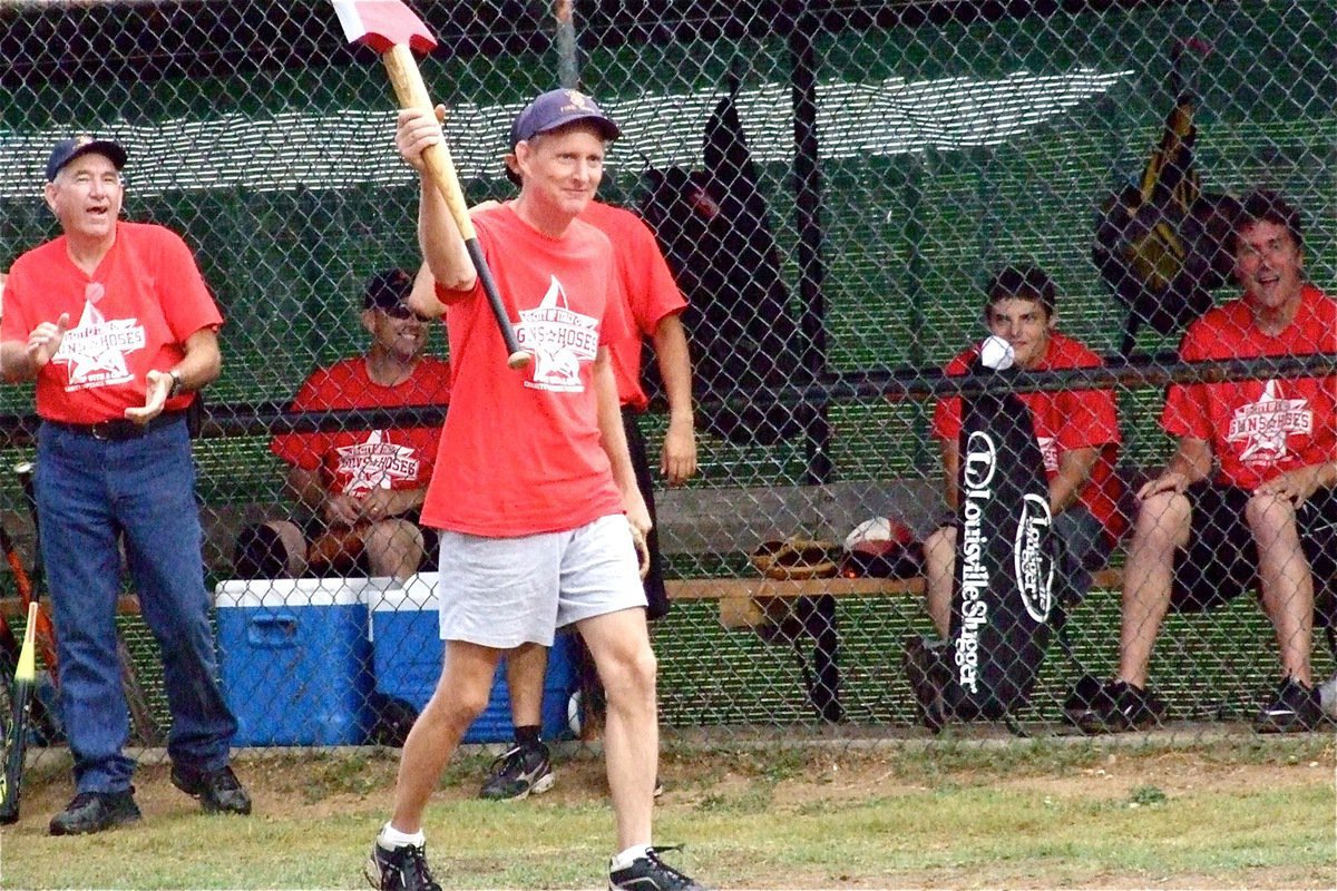 Image: Randy Boyd displays the Italy Fire Department’s battle axe during pre-game introductions.