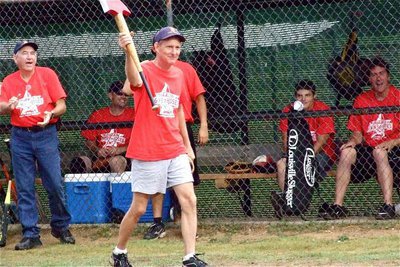 Image: Randy Boyd displays the Italy Fire Department’s battle axe during pre-game introductions.