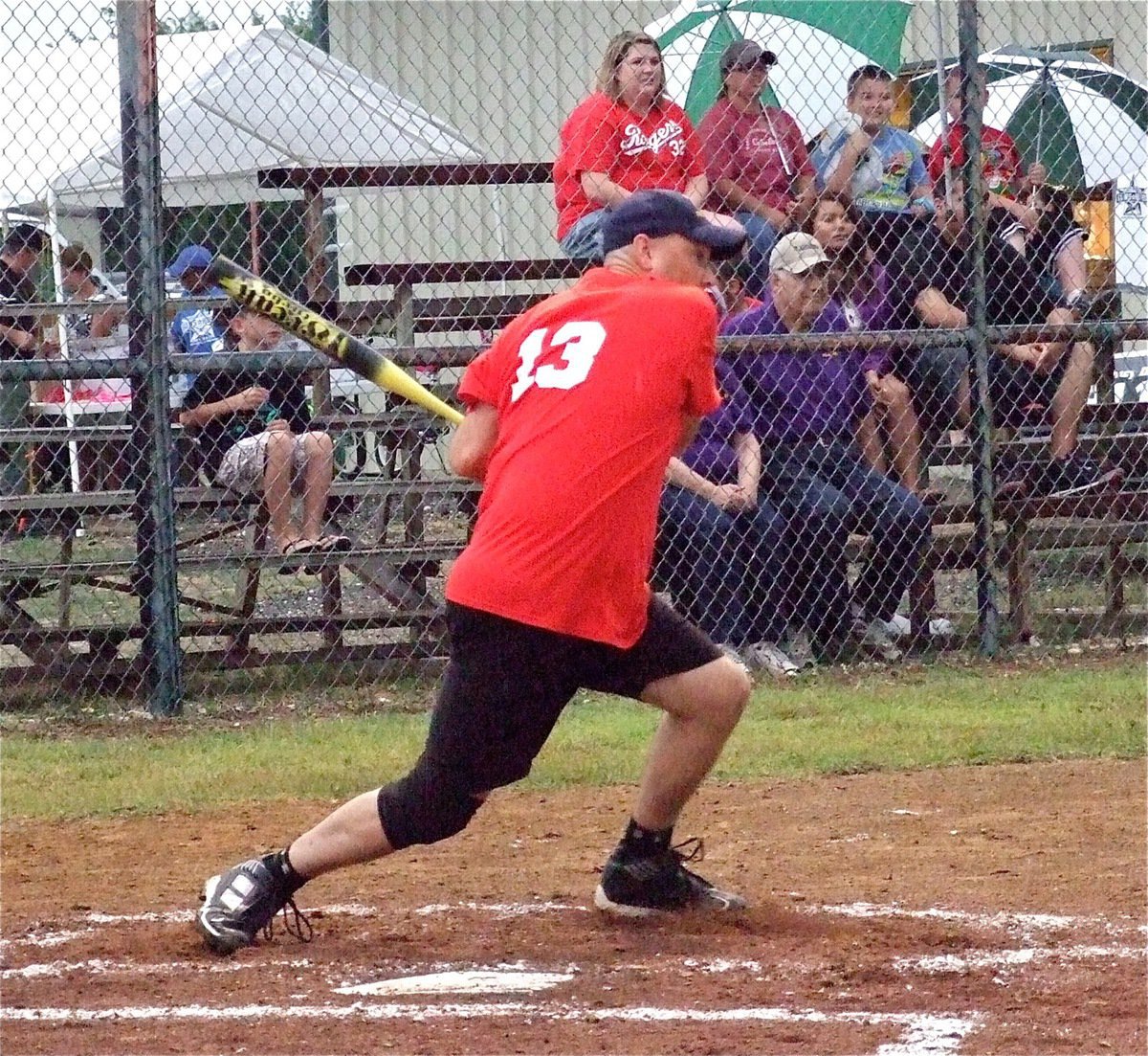 Image: Firefighter Paul Cockerham puts the ball into play.