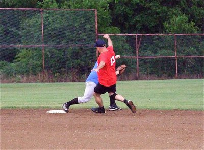 Image: I.P.D.’s Robert McFarland keeps Paul Cockerham from reaching second base.