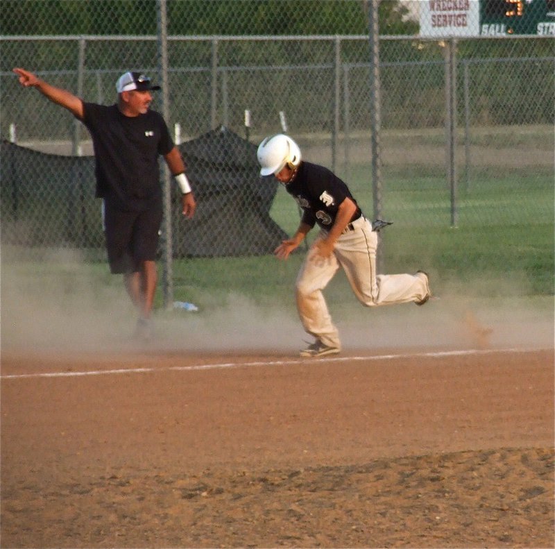 Image: Third base coach Mark Jacinto waves nephew Caden Jacinto home for an Italy run.