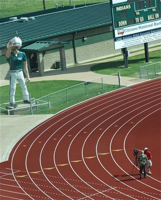 Image: From the press box, you can see Dale Hansen filming the commercial intro as cheerleaders and mascots make their way down to the field.