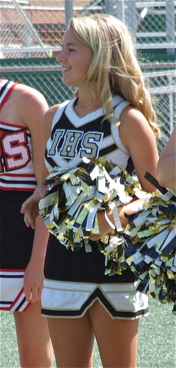Image: Italy Lady Gladiator Cheerleader Britney Chambers enjoys watching the mascots awkwardly practice a play with Dale Hansen at quarterback.
