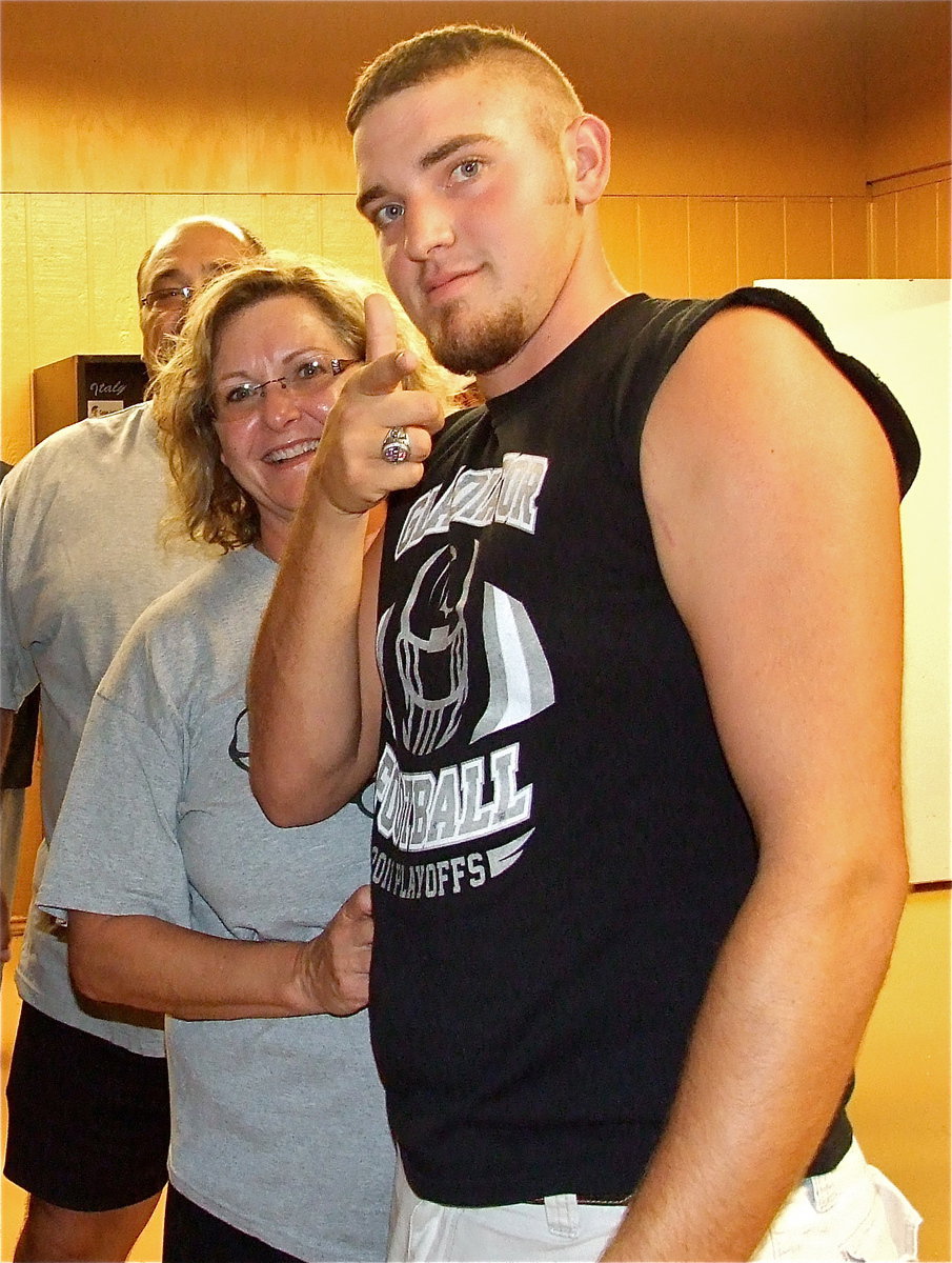 Image: Senior Gladiator Zackery Boykin checks out his new locker space with his parents Sally and Kelly.