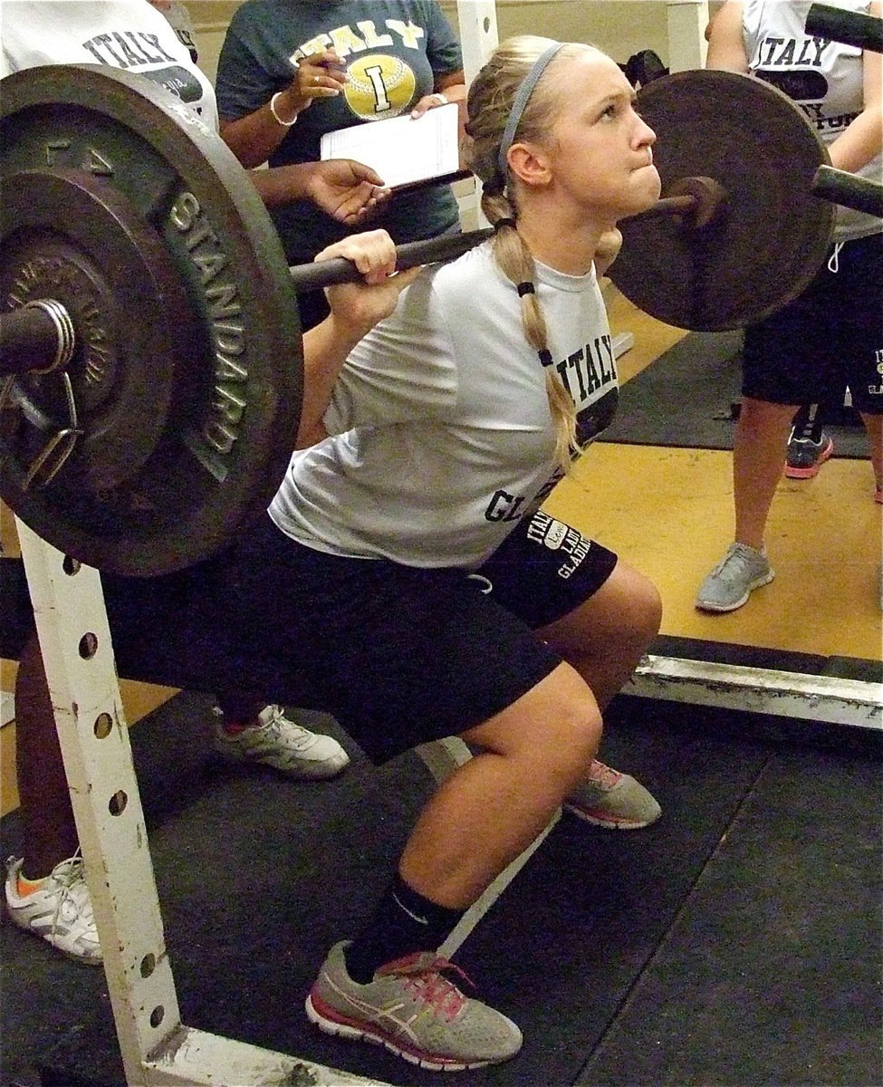 Image: Lady Gladiator Jaclynn Lewis, a sophomore, maxes out along with her volleyball teammates on Midnight Madness Monday.