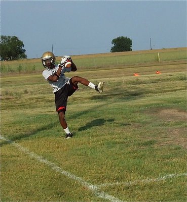 Image: Eric Carson makes one of his many outstanding catches during Wednesday’s two-a-day practices.