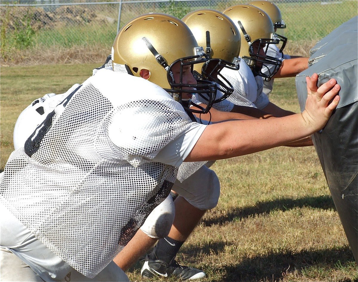 Image: John Byers and his lineman buds pop the stuffing out of the bags.