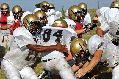Image: Jalarnce Lewis(21) and Chase Hamilton(2) combine for a tackle.