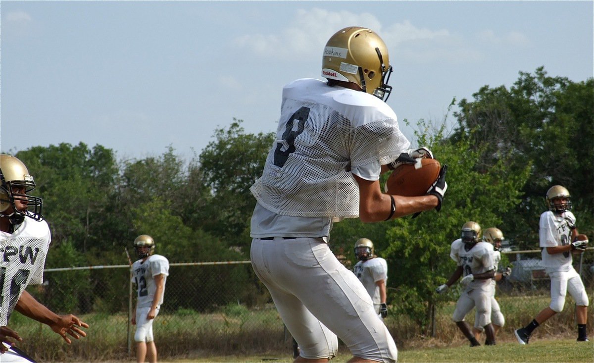 Image: Cole Hopkins(9) makes a sideline grab during Wednesdays workouts.