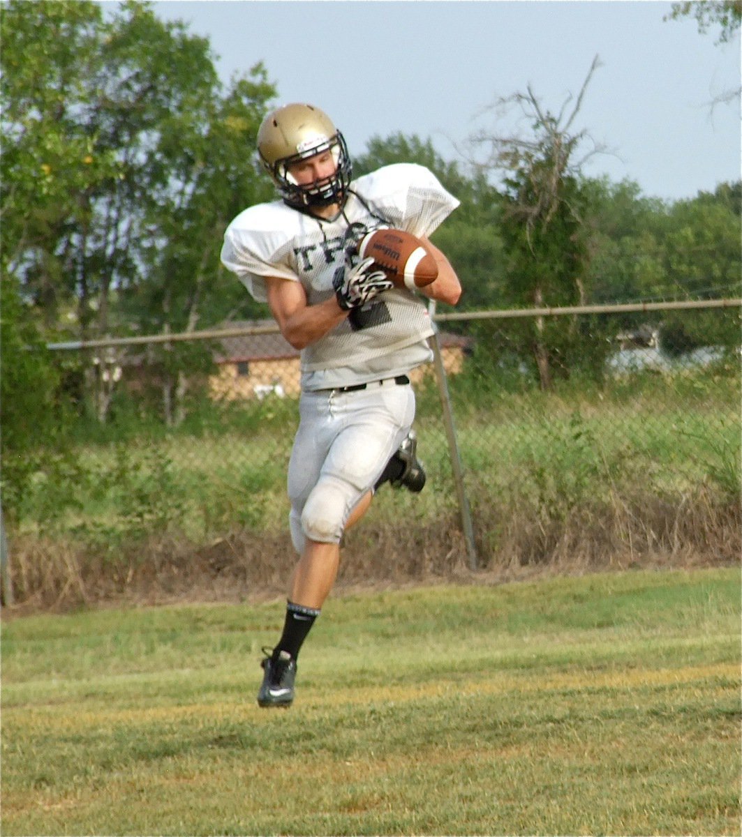 Image: Chase Hamilton(2) soars across the field to make the catch.