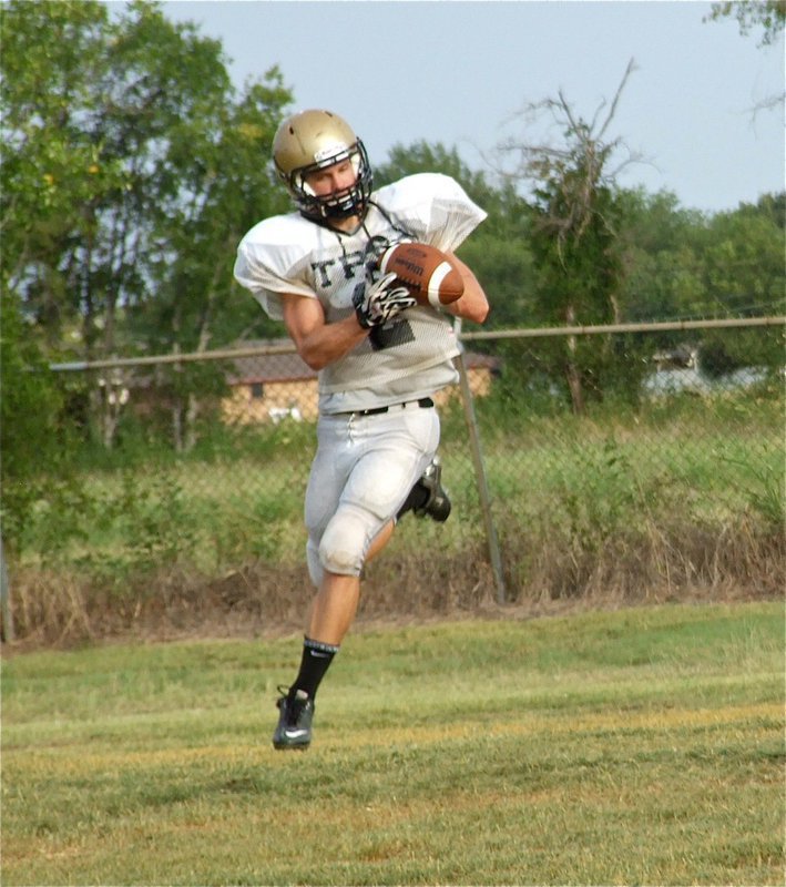 Image: Chase Hamilton(2) soars across the field to make the catch.