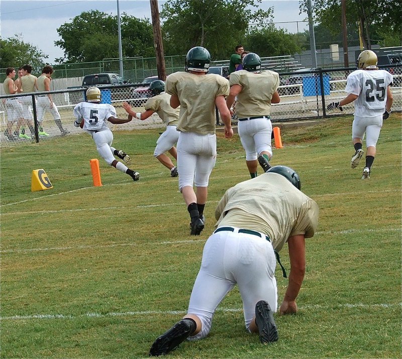 Image: Eric Carson(5) sneaks in for touchdown but the Eagles get lucky when a holding penalty brings it back.