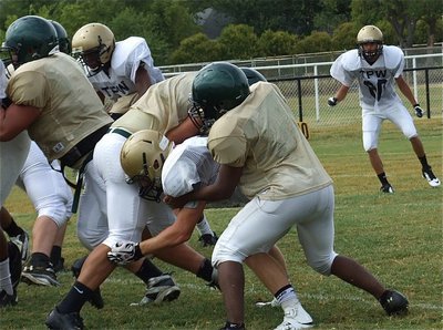 Image: Chase Hamilton(2) beats the block to clamp down on an Eagle ball carrier.