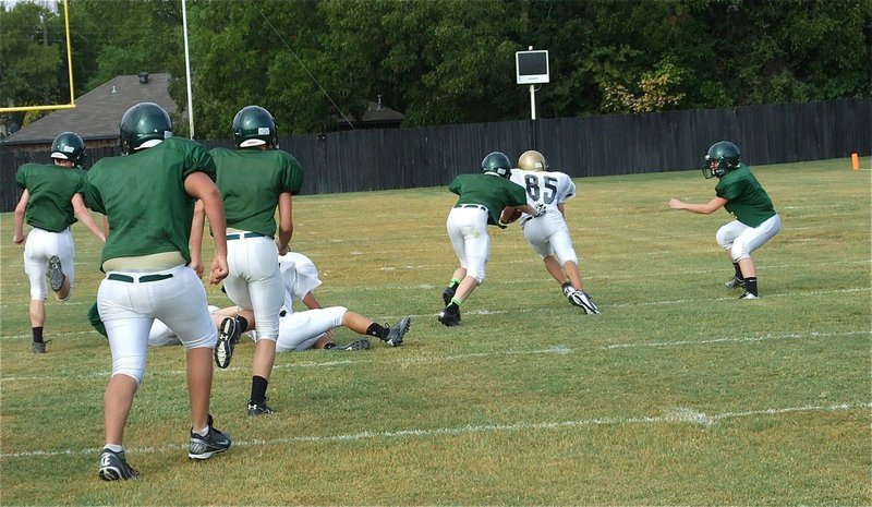 Image: Levi McBride(85) hauls in the pass from his quarterback Ryan Connor and heads upfield for the first big play of the JV scrimmage against Valley Mills.