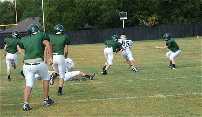 Image: Levi McBride(85) hauls in the pass from his quarterback Ryan Connor and heads upfield for the first big play of the JV scrimmage against Valley Mills.