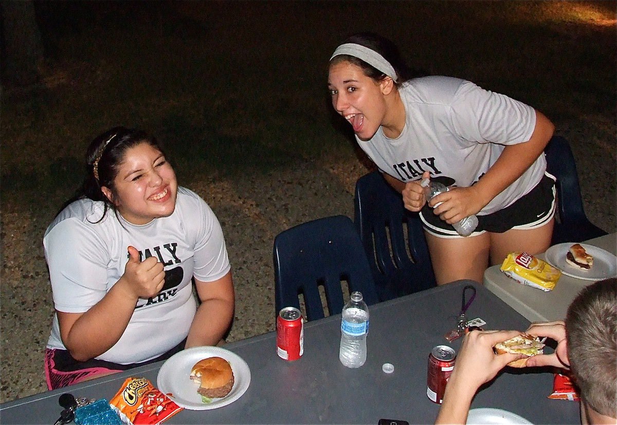 Image: Lady Gladiators Monserrat Figueroa and Alyssa Richards are loving the grub during he bash.