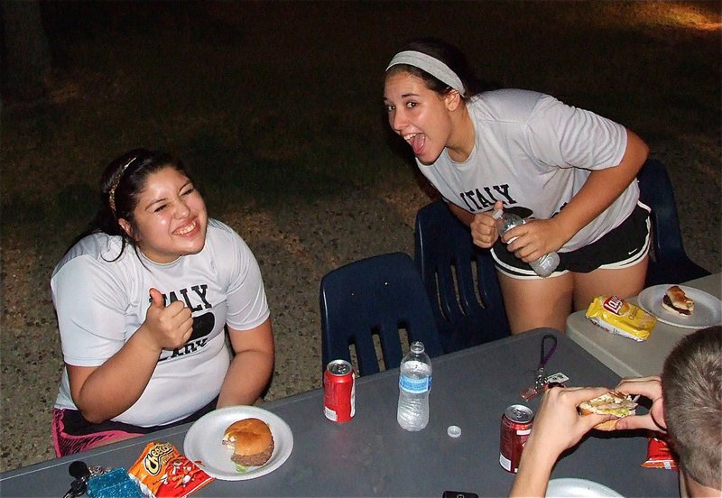 Image: Lady Gladiators Monserrat Figueroa and Alyssa Richards are loving the grub during he bash.