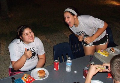 Image: Lady Gladiators Monserrat Figueroa and Alyssa Richards are loving the grub during he bash.