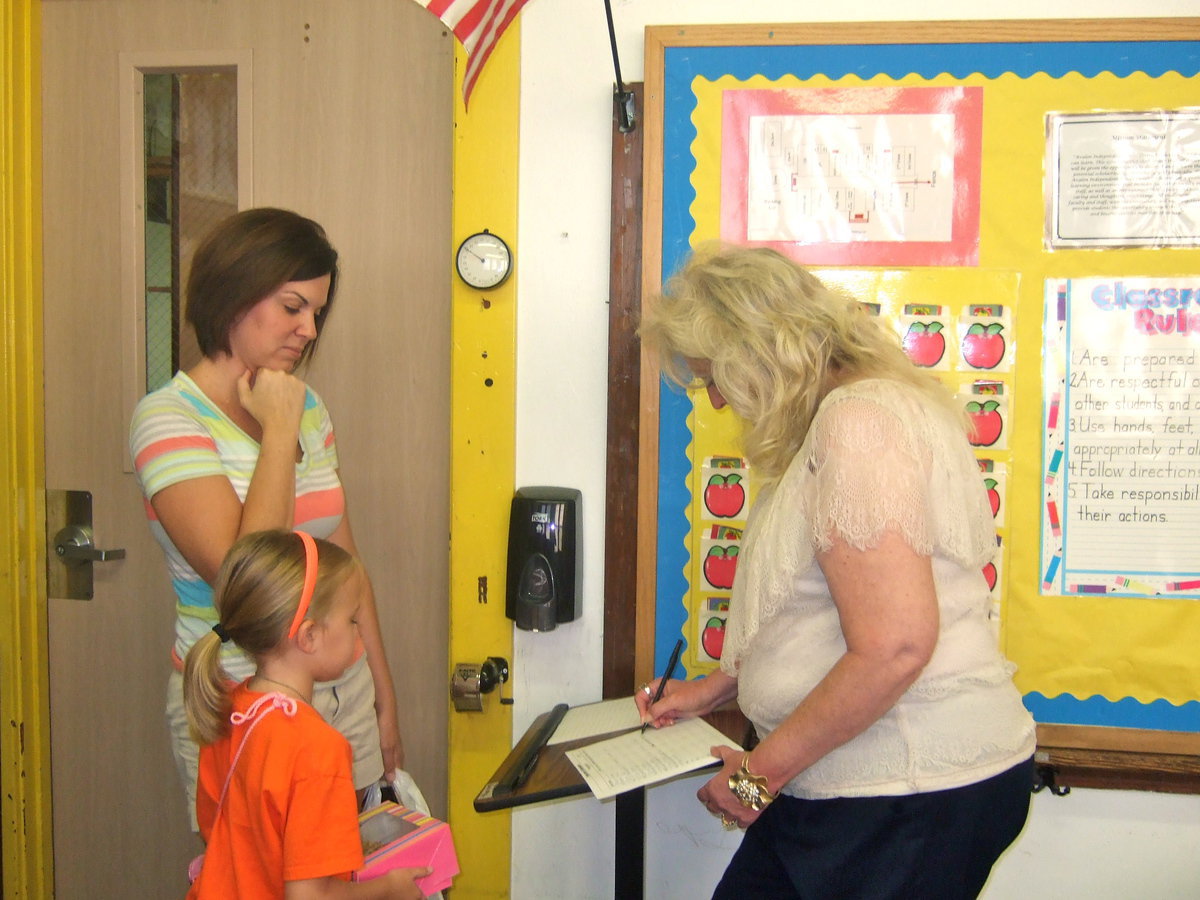 Image: Mrs Nelson getting her students all signed in.
