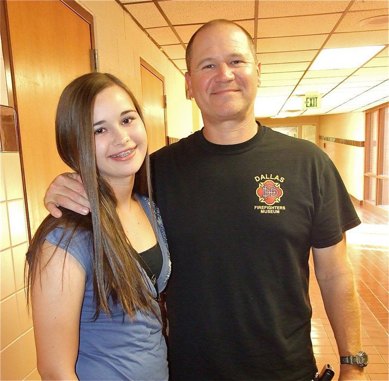 Image: Amber Hooker is accompanied by her father Jerry Hooker during Meet the Teacher Night.