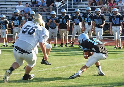 Image: John Byers(56) closing in on a Cougar back that seems to be screaming, "Blow the whistle! Blow the Whistle!