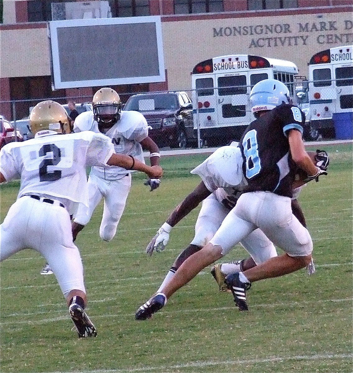 Image: Italy defenders Ryheem Walker(22), Reid Jacinto(2) and Trevon Robertson(3) close in on a Cougar.