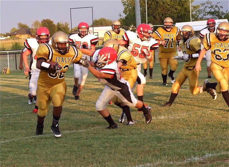 Image: The wheels on the bus go round and round: Billy “Da Bus” Moore goes the distance for a touchdown.
