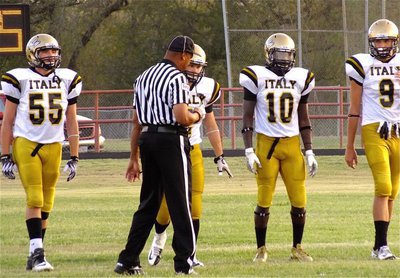 Image: Gladiator captains Zackery Boykin(55), Chase Hamilton(2), Ryheem Walker(10) and Cole Hopkins(9) head out for the coin toss.