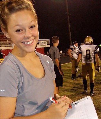 Image: Lady Gladiator Bailey Eubank helps keeps stats for Team Italy.